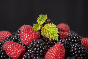 Background from fresh organic blackberries and raspberries,. Close up blackberry and raspberry