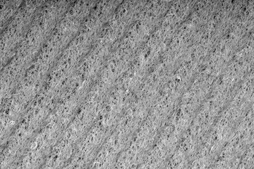 Household cleaning sponges closeup. Sponge detail texture, sponge texture close up background. Cellulose sponge texture. Wire mesh on sponge surface background. Black and white