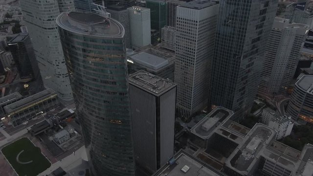 Aerial drone shot of the modern La Defense business district in Paris, France in the early morning on a cloudy day
