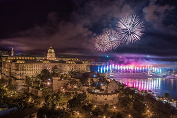 Budapest, Hungary - Aerial panoramic view of the 20th August 2019 State Foundation Day fireworks with illuminated Buda Castle Royal Palace and Szechenyi Chain Bridge by night - obrazy, fototapety, plakaty