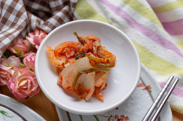 Kimchi and Gimbap serving on white plate