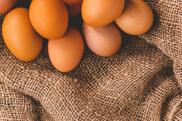 close-up of chicken eggs on sackcloth