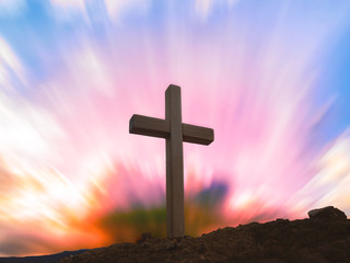 Silhouettes of crucifix symbol with bright sunbeam on the colorful sky background