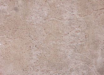 rough pebbles sand on cement concrete background texture, crack on wall pattern.  