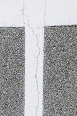 Fototapeta premium asphalt road texture, cracked street with white painted line for traffic signs