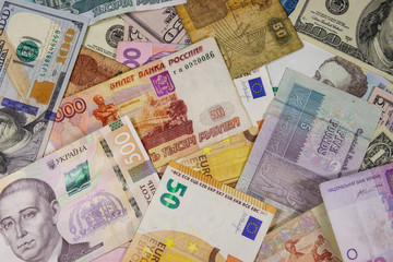Multicurrency background of euros US dollars, Russian rubles, Egyptian pounds and Ukrainian hryvnias