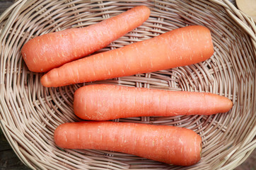 fresh carrot in basket 