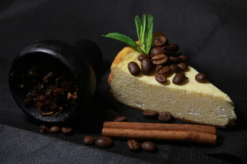 bowl with tobacco for hookah. berries on a black background