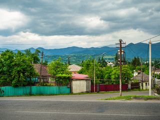 Fototapeta na wymiar Side view of a street in town of Zestafoni, Georgia.