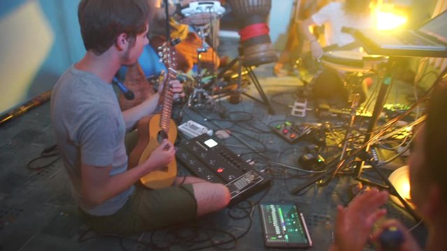 musician plays guitar in jam session