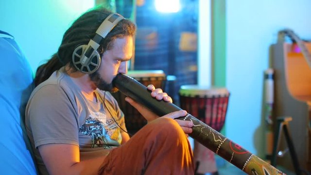portrait of a musician who plays didgeridoo