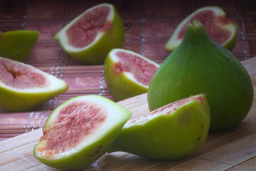 The harvest of ripe fig fruit on the wooden table