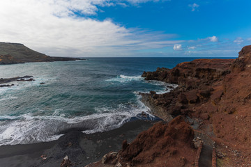 Fototapeta premium Beautiful rigid volcanic beaches in El Golfo on Lanzarote island, Canary Islands, Spain. 