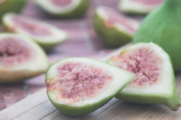 The harvest of ripe fig fruit on the wooden table