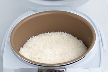 Jasmine rice cooking in electric rice cooker.       