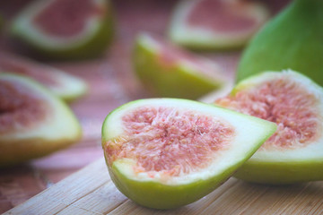 The harvest of ripe fig fruit on the wooden table