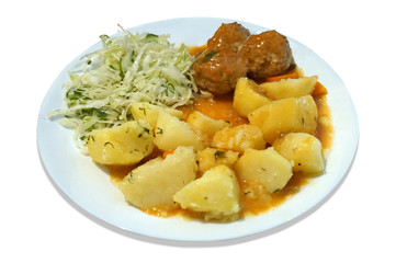 Meatballs - pork, beef, potatoes and salad on plate