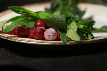 frozen cranberries and mint, close-up
