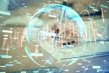 Fototapeta na wymiar Multi exposure of hands making notes with forex chart huds. Stock market concept.