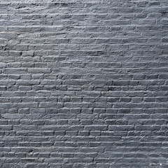 part of silver grey painted brick wall