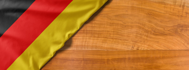 National flag of Germany on a wooden background with copy space