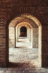 Fototapeta na wymiar Brick arches in the caravanserai in the Shaki city