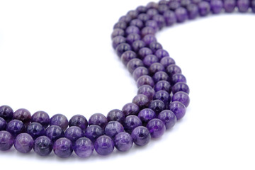 Purple amethyst natural stone round shape bead isolated on white background