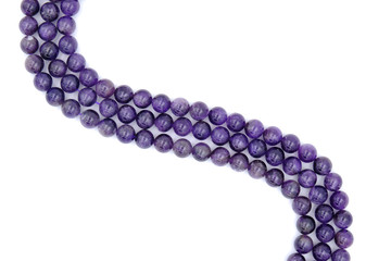 Purple amethyst natural stone round shape bead isolated on white background