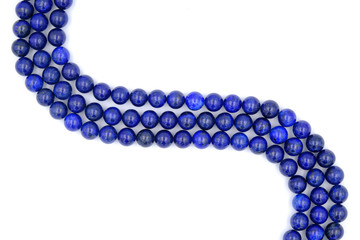 Blue lapis lazuli natural stone round shape bead isolated on white background