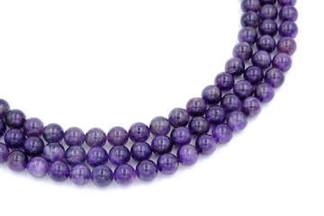 Purple amethyst natural stone round shape bead isolated on white background