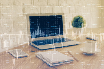 Financial chart drawing and table with computer on background. Double exposure. Concept of international markets.