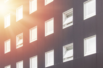 Abstract image row of closed and opened windows decorate on wall of building. (Selective focus)