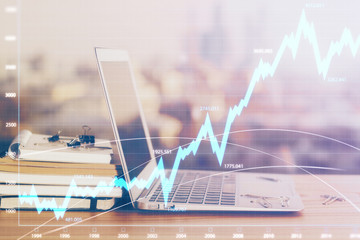 Forex market chart hologram and personal computer background. Double exposure. Concept of investment.