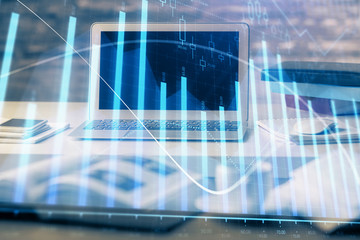 Financial market graph hologram and personal computer on background. Multi exposure. Concept of forex.