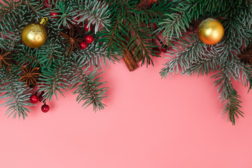 Fototapeta na wymiar Christmas decorations on pink background. Copy space. Christmas concept.