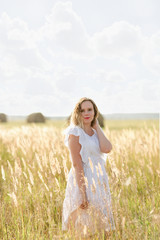 Fototapeta na wymiar young woman in wheat field