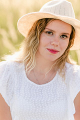 portrait of young woman in hat