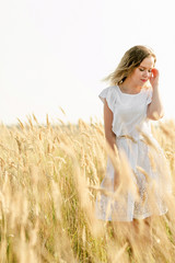 woman in field of wheat