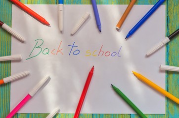 The motive for returning children to school. Felt-tip pens with the words back to school.