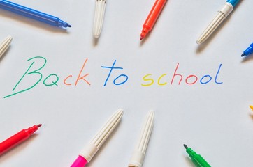 The motive for returning children to school. Felt-tip pens with the words back to school.