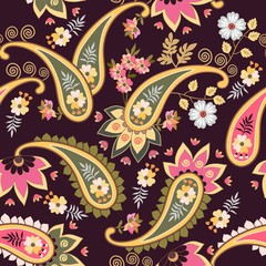 Colorful seamless ethnic ornament with paisley, leaves and flowers on dark purple background. Print for fabric, wallpaper, wrapping deswign.