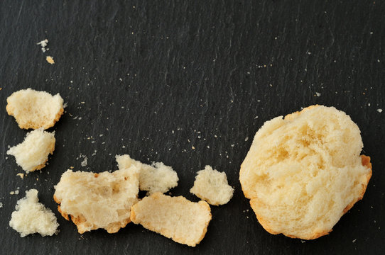 Italian bread, crumbs and bits, on slate plate