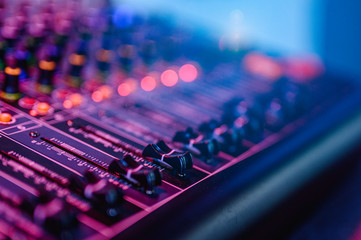 Professional audio mixing console in concert.