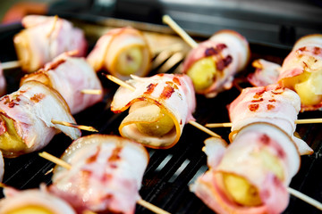 Grilled potato with bacon on gas grill . Grilled food. Barbecue. Copy space. Healthy food.