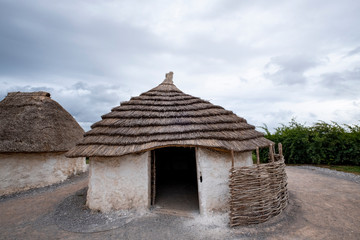 Stone Age mud hat replica at Stonehenge, England, UK