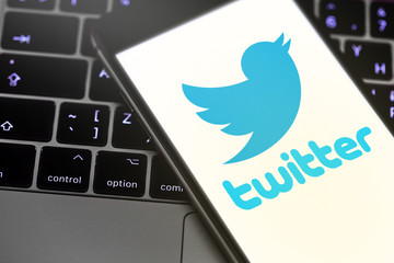 iPhone with Twitter logo on the screen. Twitter is a social media online service for microblogging and networking communication. Moscow, Russia - March 26, 2019