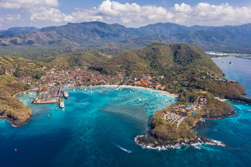 Aerial view of the Padang Bai harbor and beach in Bali, Indonesia. © D.Marti