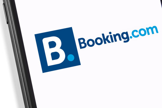 smartphone with Booking logo on the screen. Booking.com is service for booking rooms, enabling people to lease or rent short-term lodging. Moscow, Russia - March 17, 2019