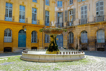 Fototapeta premium stone fountain in mediterranean city with historical building 
