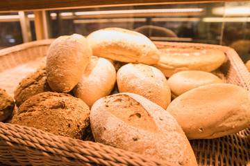 Various types of bread in a wooden basket